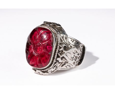 **NO RESERVE**An Indian Silver Ring with Faceted Gemstone, Possibly Ruby.This Indian silver ring features an intricately desi