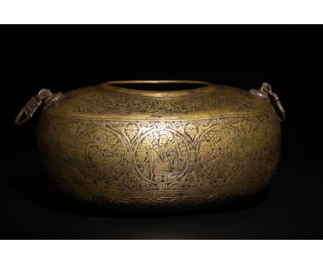 A Qajar Brass Kashkul Beggar's Bowl with Islamic Calligraphy and Figural Scenes, 19th Century.The surface is adorned with int