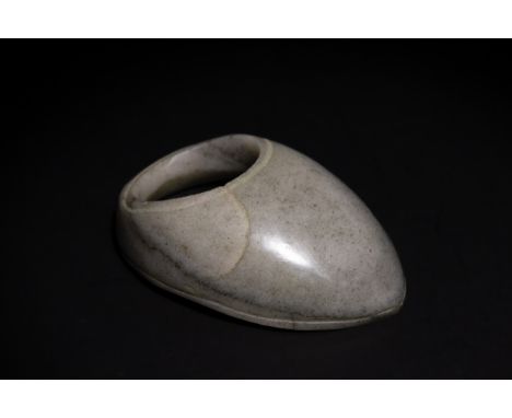 ** NO RESERVE**An Indian Jade Archer Thumb Ring.This finely crafted thumb ring, made from smooth jade, features a sleek, poli