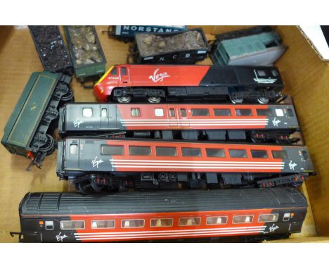 Five model railway wagons and a Hornby 'Virgin' railway engine with three carriages 