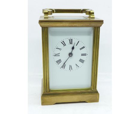 A brass and four glass sided carriage clock and key, 11.5cm 