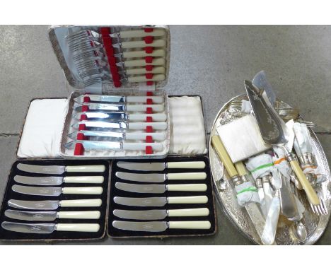 A plated compact, plated tray and flatware and three cased cutlery sets 