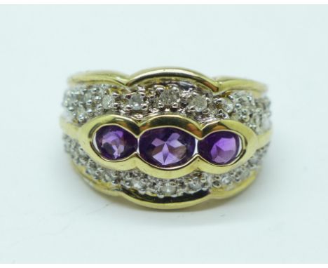 A 9ct gold, diamond and amethyst ring, 0.25carat diamond weight, 4.5g, L 