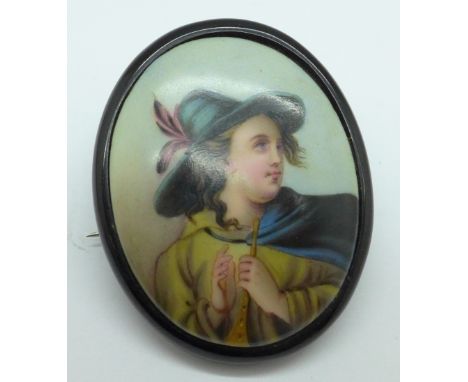 A jet mounted hand decorated portrait brooch 