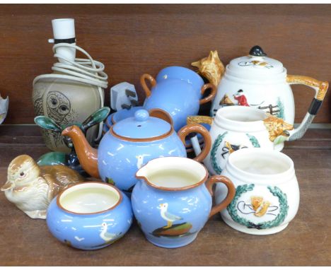 A three piece fox hunting tea service, a Dartmouth Pottery tea for two teaset, a Poole Pottery duckling and a Blue Mountain l