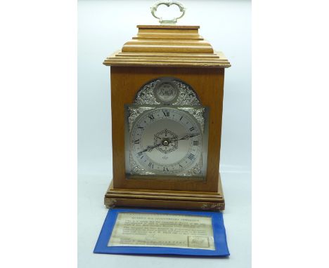 An Elliott oak mantel clock, Queen's 25th Anniversary Timepiece, 121/500 with certificate 
