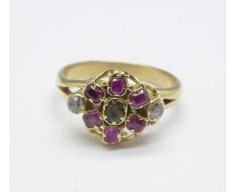 A yellow metal, ruby, emerald and white stone cluster ring, tests as 9ct gold, 2.2g, H 