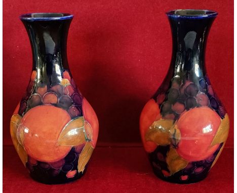 PAIR OF MOORCROFT GLAZED AND HANDPAINTED CERAMIC VASES DECORATED WITH FRUIT AND FOLIAGE, APPROXIMATELY 15cm HIGH CRAZING THRO