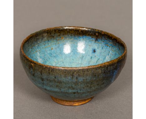 A Chinese Yuan Dynasty Jun Ware pottery bowlWith typical glaze.  8.5 cm diameter.Provenance: From the late Harry Lakin Collec