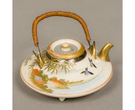 A Meiji period Japanese Satsuma miniature teapot Of flattened circular form, with rattan handle; together with a miniature cl