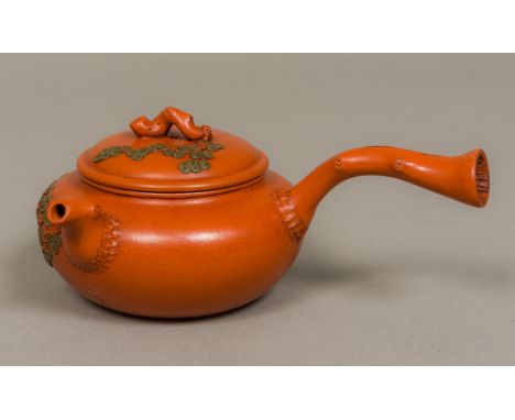 A Chinese Ying Ying teapot The faux wood handle mounted to the side, the spout and lid finial issuing trailing foliage, signe