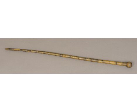 A 19th century horn walking stick
Of segmented form, with turned knop handle.  84 cm long.  CONDITION REPORTS: Some splits, s