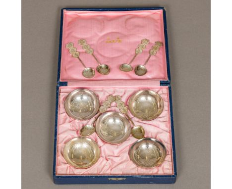 A set of five Chinese silver salts The interiors worked with various flora and fauna, stamped marks, cased; together with six