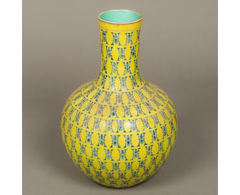 A Chinese porcelain baluster vaseWith allover blue decoration on a yellow ground, the underside with six character blue paint