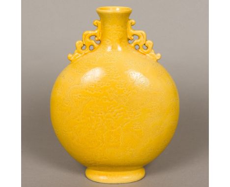 A Chinese yellow ground porcelain moon flaskOf typical form, with pierced handles, the main body incised in the round with fi