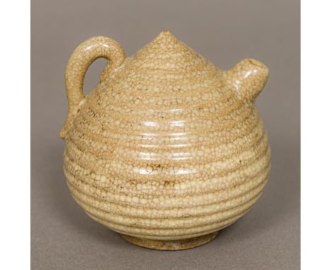 A Chinese "Five Kingdoms" pottery water dropperOf ribbed beehive form.  8.5 cm high.Provenance: From the late Harry Lakin Col