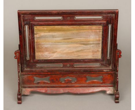 A Chinese hardstone inset wooden table screenOf typical sliding form, centred with a hardstone panel with seal mark and calli