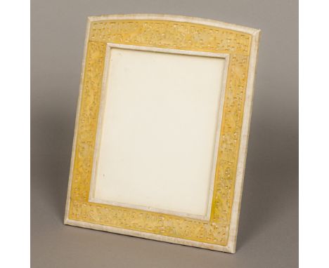A Chinese carved and pierced jade mounted photograph frame
Extensively worked with birds amongst floral strapwork, with easel