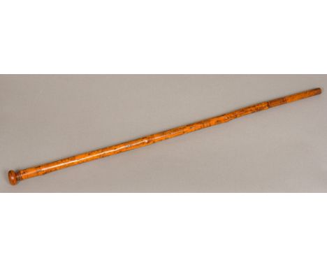 A 19th century Folk Art engraved treen walking stick 
Decorated in the round with figures in various pursuits including fishi