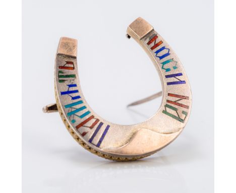 A Russian enamel decorated silver broochOf horseshoe form, with calligraphic decoration, the reverse with 84 Zolotnik mark, m