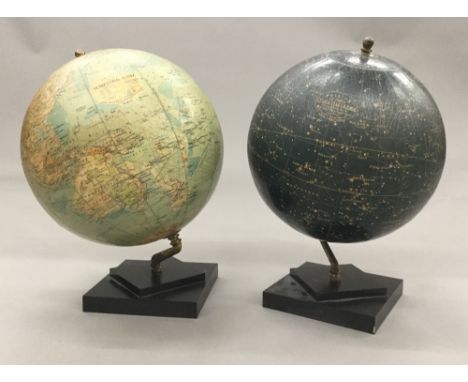 A Phillips 12 inch terrestrial globeTogether with a Phillips 12 inch celestial globe en suite, both typically mounted on ebon