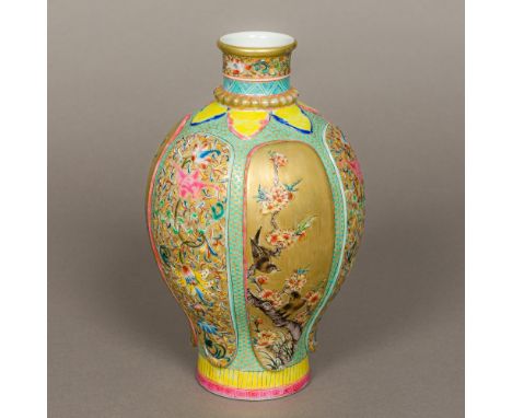 A Chinese porcelain baluster vaseWell painted with birds amongst floral panels interspersed with lotus strapwork on raised pa