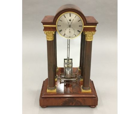 An early 19th century ormolu mounted mahogany cased regulator table clock, by  Edward Simmons of LondonOf arched portico form