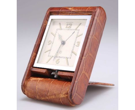 A JAEGER-LE-COULTRE TRAVEL CLOCK, Art Deco style, the rectangular cream dial with Arabic quarter numerals, on an eight day mo