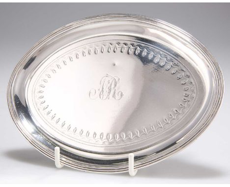 A GEORGE III SILVER TEAPOT STAND, by Peter, Ann &amp; William Bateman, London 1801, oval, with reeded border and bright-cut e