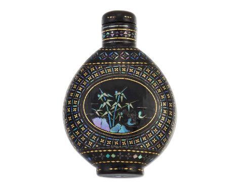 A VICTORIAN PAPIER-MÂCHÉ SNUFF BOTTLE, typical form, decorated with mother-of-pearl and gilt with reserves of bamboo and prun