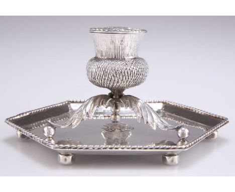 AN ARTS AND CRAFTS SILVER INKWELL AND STAND, by Frederick Smythe-Greenwood, London, the thistle-form inkwell, 1911, inscribed