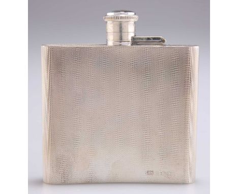 A GEORGE VI SILVER HIP-FLASK, by A Wilcox, Birmingham 1948, shaped for the pocket, with an engine-turned ground. 10cm high, 9