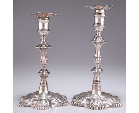 TWO 18TH CENTURY CAST SILVER CANDLESTICKS, the first by John Cafe, London 1751, the second by Ebenezer Coker, London 1761, ea