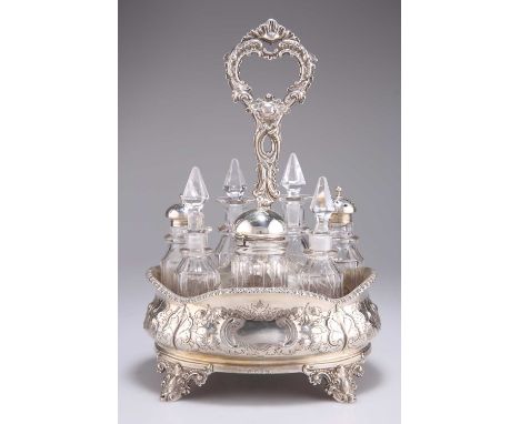 A VICTORIAN SILVER SEVEN-BOTTLE CRUET, by Roberts &amp; Hall, Sheffield 1852, the stand embossed with acanthus leaves, flower