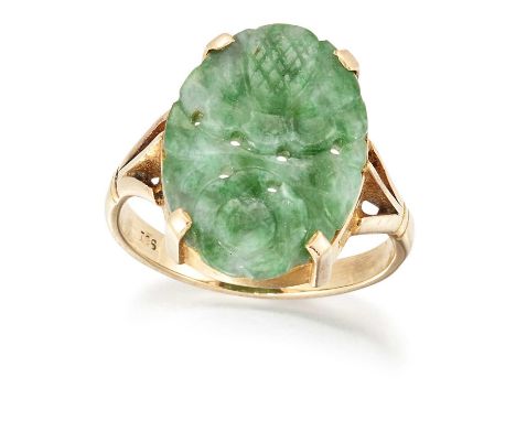 A JADE RING, an oval jade foliate carved and pierced, in a claw setting to forked shoulders. Marked ‘9CT’, ring size P, 3.7 g