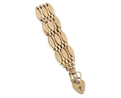 A 9 CARAT GOLD FANCY GATE LINK BRACELET, of textured and plain polished links, to a 9 carat gold padlock clasp. Hallmarked Lo