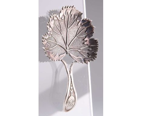 A GEORGE III SILVER CADDY SPOON, by Joseph Taylor, Birmingham 1809, in the form of a leaf, engraved with a monogram. 7.5cm lo