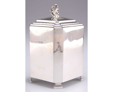 A GEORGE V SILVER TEA CADDY, by Lionel Alfred Crichton, London 1919, of square-section with canted corners and shell-form fin