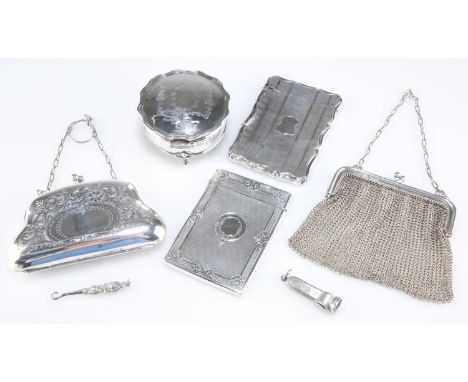 TWO VICTORIAN SILVER CARD CASES, the first by Colen Hewer Cheshire, Birmingham 1872, with scrolling edges and bands of engine