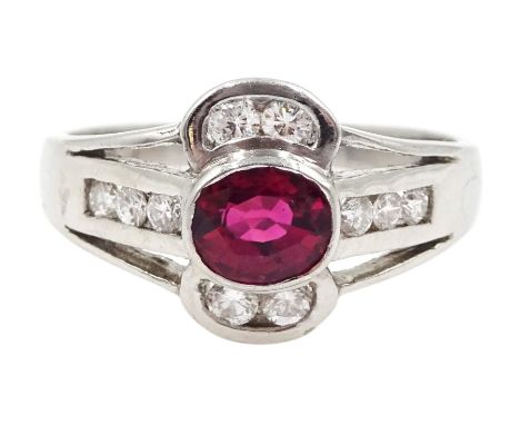 18ct white gold oval ruby and diamond ring, hallmarkedClick here to view further images, condition reports, sale times &amp; 