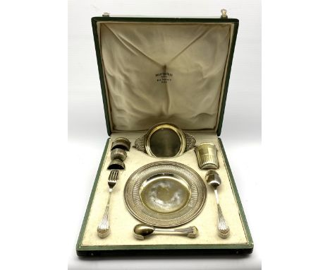French silver and parcel gilt christening set comprising a circular plate with chased leaf decoration D20cm, dessert spoon an
