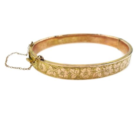 Early 20th century rose gold hinged bangle, engraved floral and foliate decoration by S Ward &amp; Sons, Chester 1916, approx