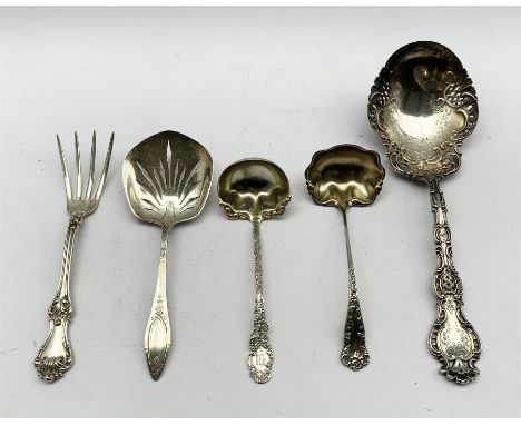 American sterling silver serving spoon by Whiting &amp; Co with shell finial, engraved and pierced stem, two sterling sauce l