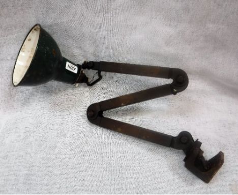 A MID-20TH CENTURY ENGINEERS INDUSTRIAL ADJUSTABLE LAMP with green enamel shade