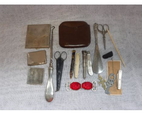 A SILVER HANDLED BUTTON HOOK, a silver and mother-of-pearl knife and a collection of other items