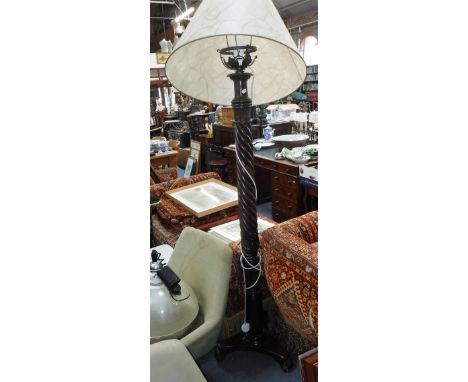 A MAHOGANY 'BEDPOST' STANDARD LAMP