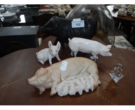 A PINK CERAMIC STUDY OF A PIG and similar studies of pigs