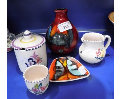 A SMALL COLLECTION OF POOLE POTTERY including floral decorated wares and a red and orange vase