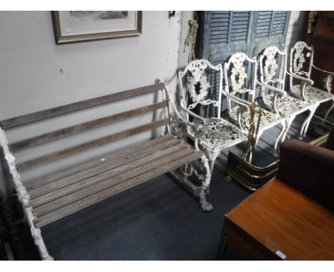 A SET OF FOUR WHITE PAINTED METAL GARDEN ARMCHAIRS (one arm broken) and a similar garden bench