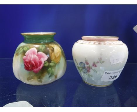 A ROYAL WORCESTER VASE decorated with floral sprays and another similar